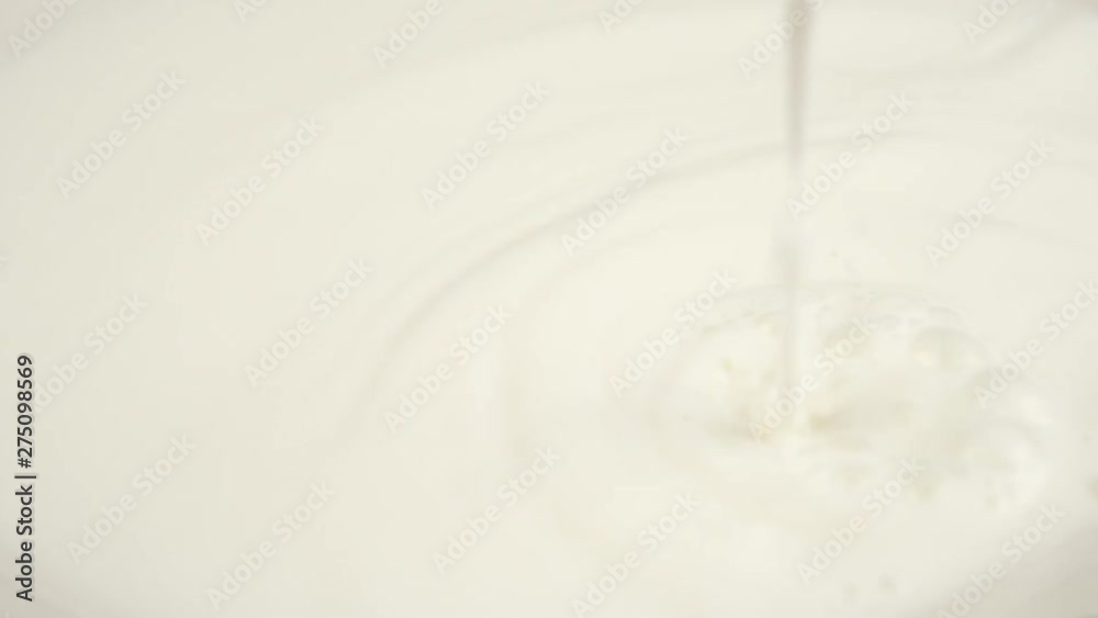 Pouring Milk closeup. Milk Splesh Slow Motion. Pouring Milk closeup. Milk Splesh Slow Motion.