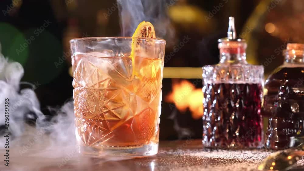 Alcohol cocktail with ice cubes on bar, slow motion 4k Alcohol cocktail with ice cubes on bar, slow motion 4k