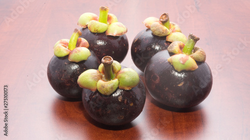 Tropical fruits mangosteen on the wooden table