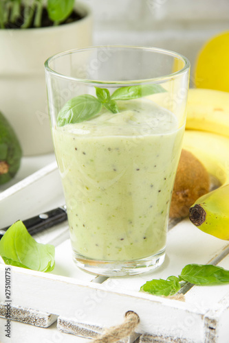 Green smoothie with banana, kiwi, Basil and avocado. Delicious healthy drink, summer snack, fresh taste