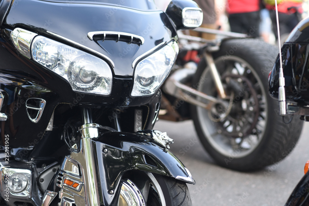 A motorbike on the show with chrome details and other parts, closeup with depth of field openair A motorbike on the show with chrome details and other parts, closeup with depth of field openair