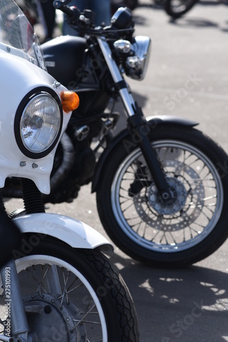 A motorbike on the show with chrome details and other parts, closeup with depth of field openair