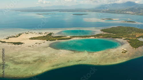 aerial view Honda bay with tropical islands and sandy beaches surrounded by coral reef with azure water, top view. Summer and travel vacation concept, Puerto princesa, Palawan, Philippines.