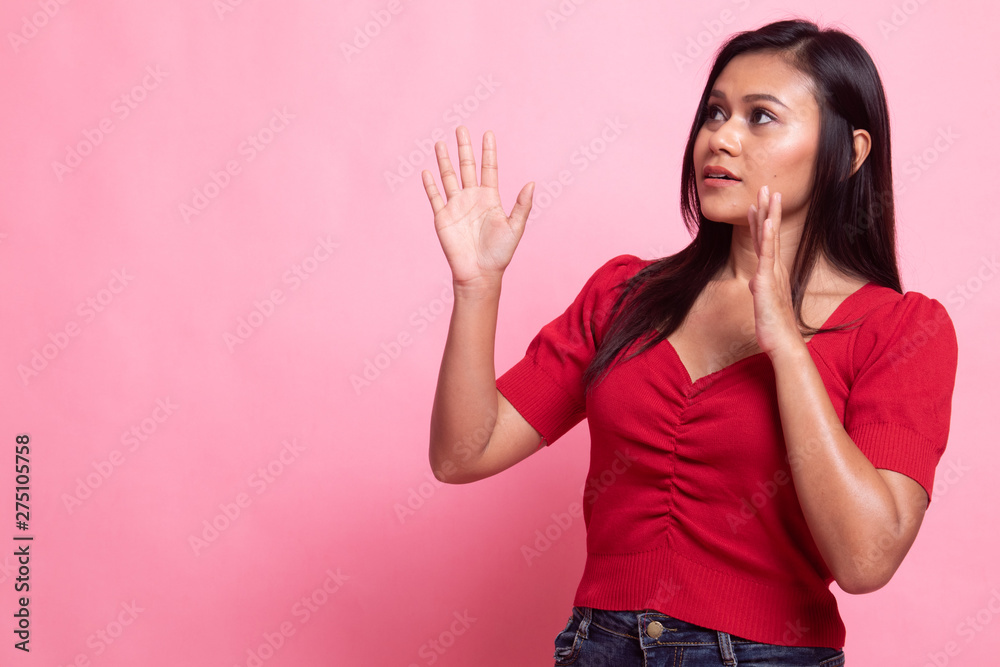 Beautiful young Asian woman shocked and look up. Beautiful young Asian woman shocked and look up.