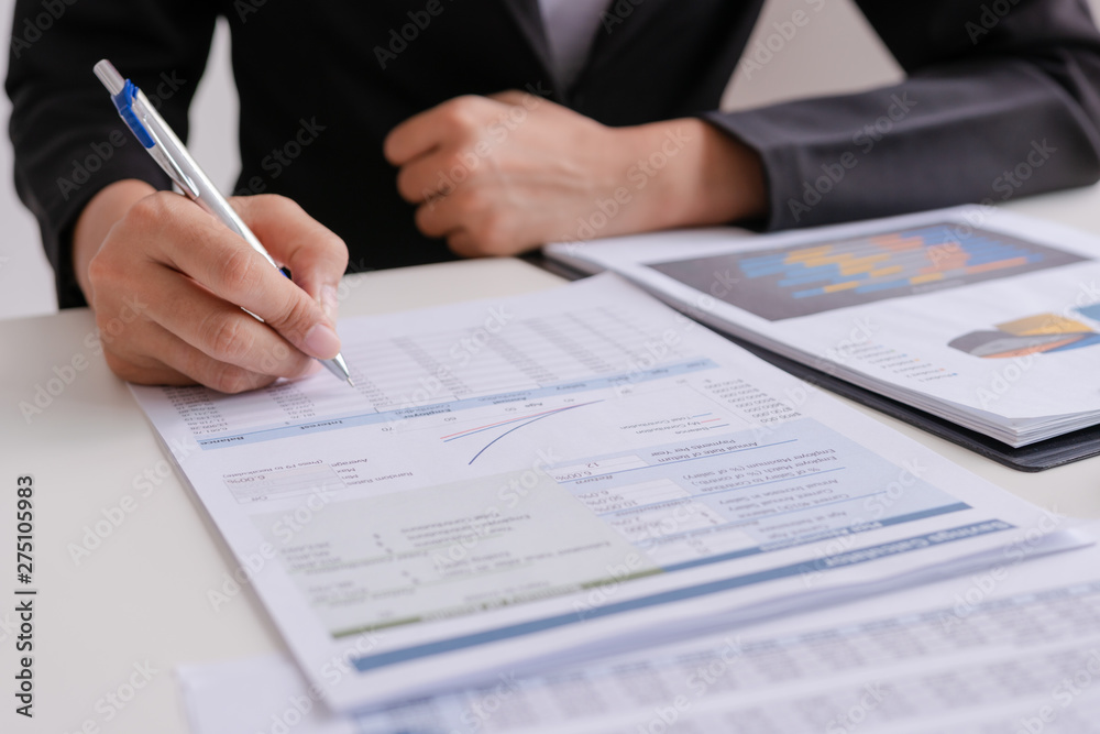 Businessman or Manager work with financial paper report, business planing and analysis of growth concept. Businessman or Manager work with financial paper report, business planing and analysis of growth concept.