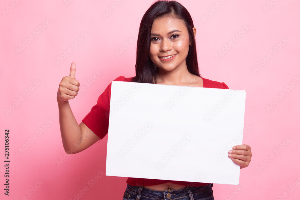 Young Asian woman show thumbs up with white blank sign. Young Asian woman show thumbs up with white blank sign.