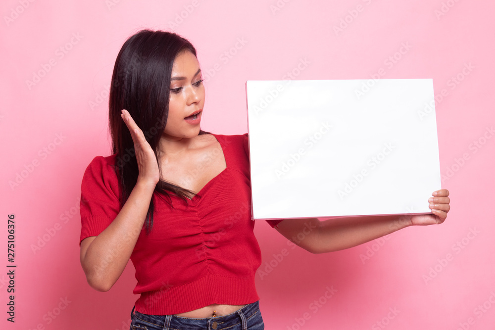 Young Asian woman surprise with white blank sign. Young Asian woman surprise with white blank sign.