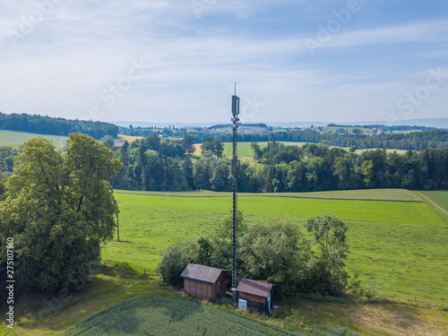 Tableau sur toile Aerial view of mobile phone antenna tower in rural area in Switzerland