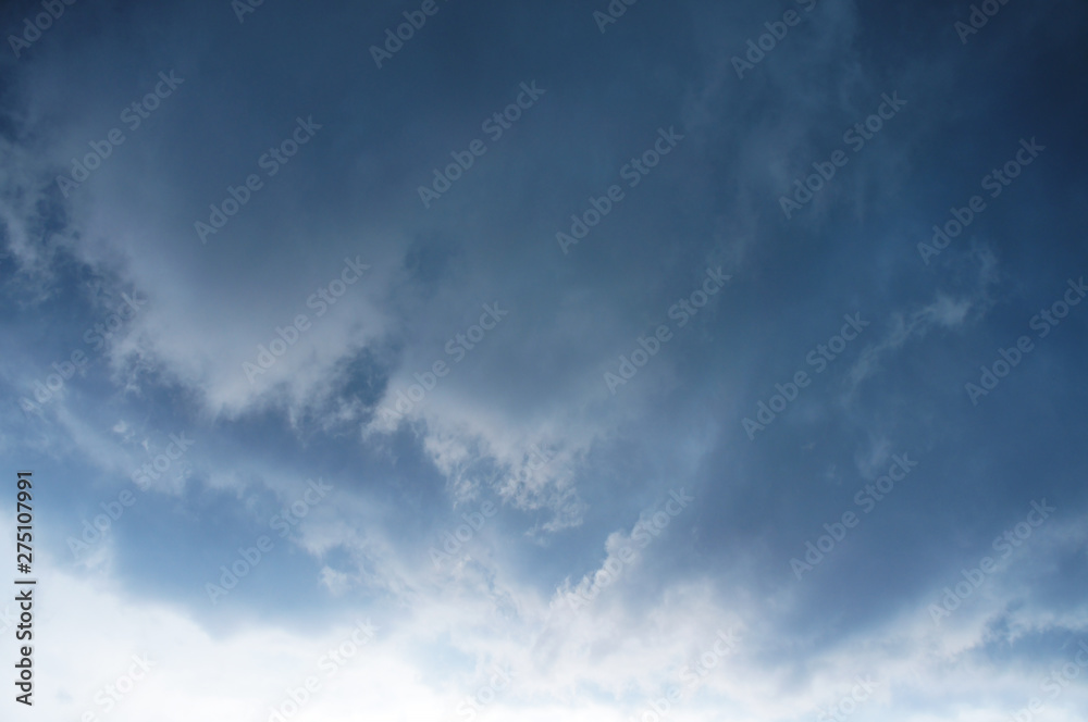 Gloomy scary rain clouds in the blue sky. Gloomy scary rain clouds in the blue sky.