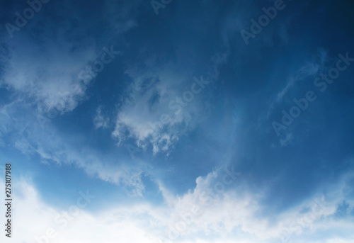 Gloomy scary rain clouds in the blue sky.