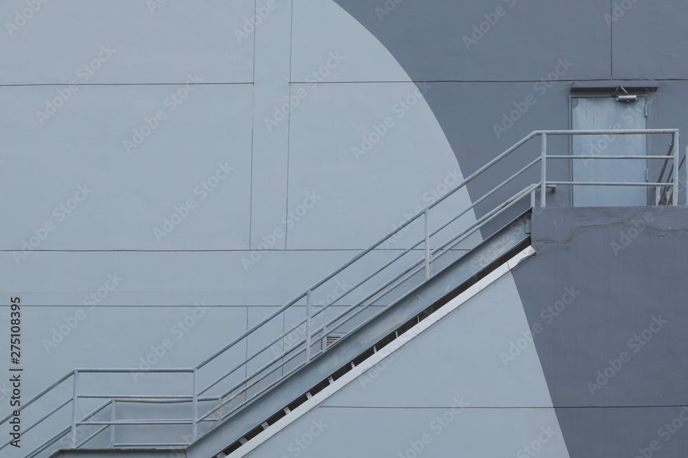 Fototapeta premium The stair for fire escape with the concrete wall of the mall building.