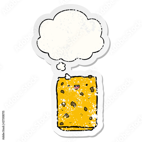 cartoon biscuit and thought bubble as a distressed worn sticker