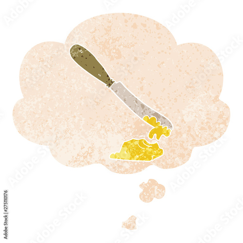 cartoon knife spreading butter and thought bubble in retro textured style