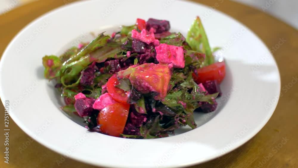 The fresh salad with beets rotates in a circle. Very appetizing The fresh salad with beets rotates in a circle. Very appetizing