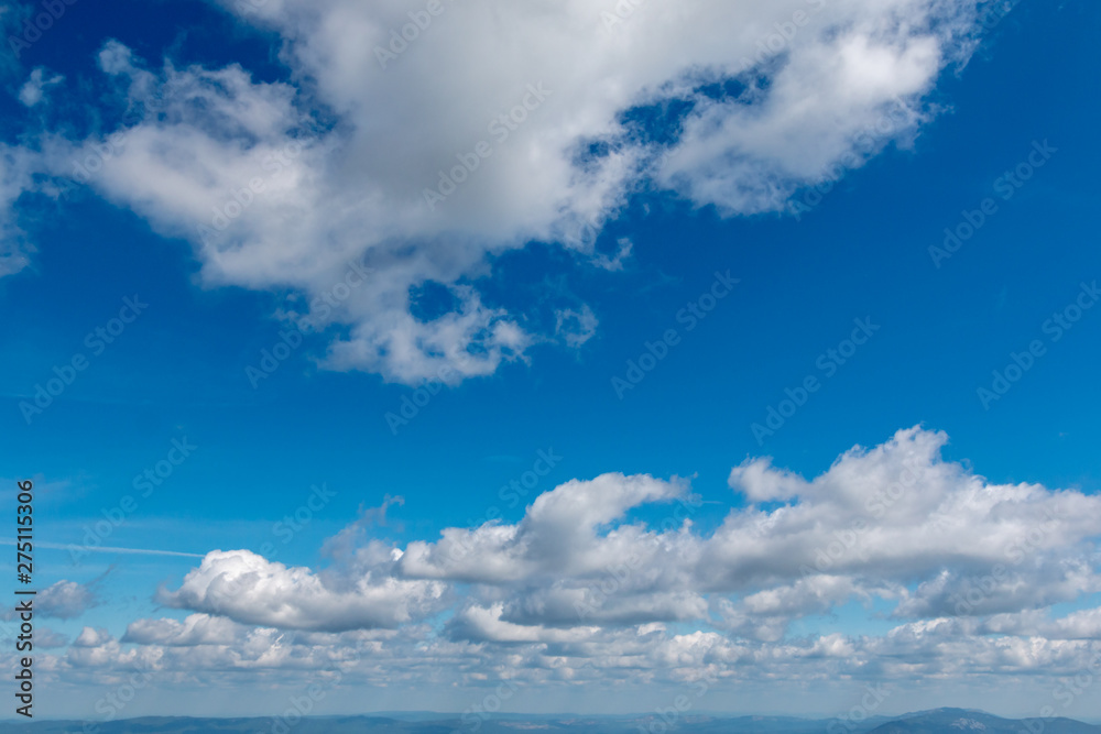 white clouds in bright blue sky white clouds in bright blue sky