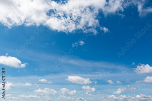 white clouds in bright blue sky