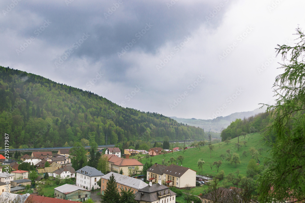 Orava Podzamok, Slovakia. May, 2019. The famous medieval castle in the Slovak Tatras on the edge of chipped. Visited tourist place. Mountain, river, village. Postcard. Orava Podzamok, Slovakia. May, 2019. The famous medieval castle in the Slovak Tatras on the edge of chipped. Visited tourist place. Mountain, river, village. Postcard.