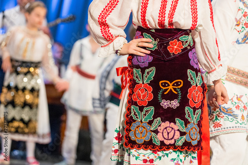 Close up s of young Romanian dancers perform a folk dance in traditional folkloric costume. Folklore of Romania