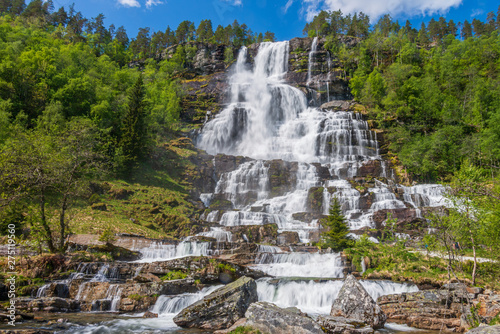 Tvindefossen waterfall in summer season  Norway.