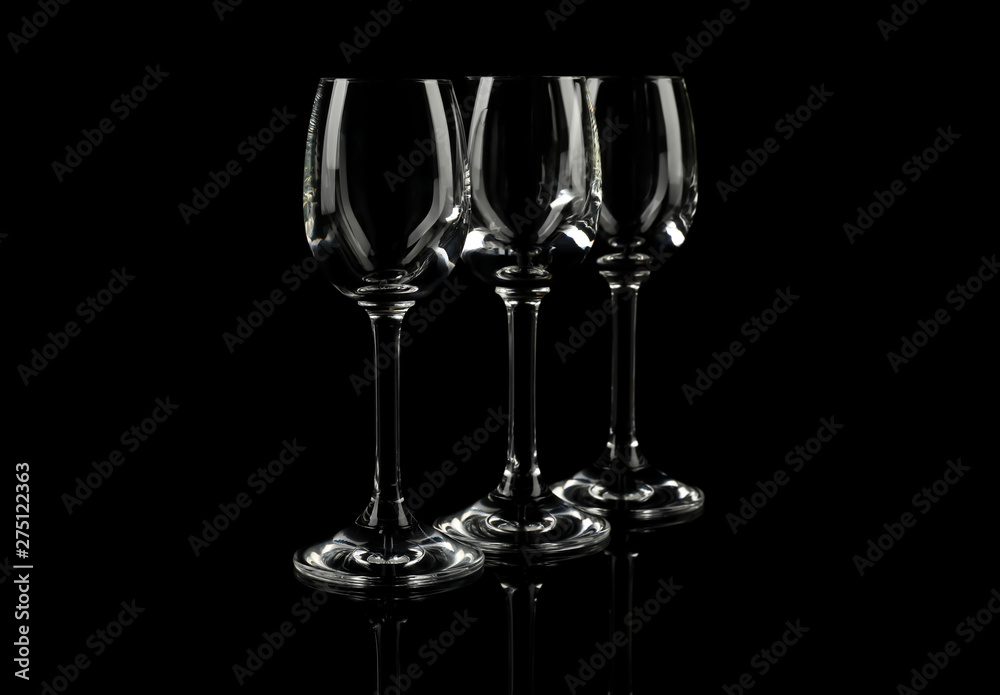 Set of empty glasses on black background