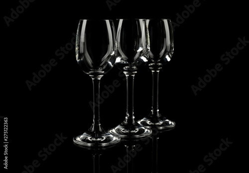 Set of empty glasses on black background