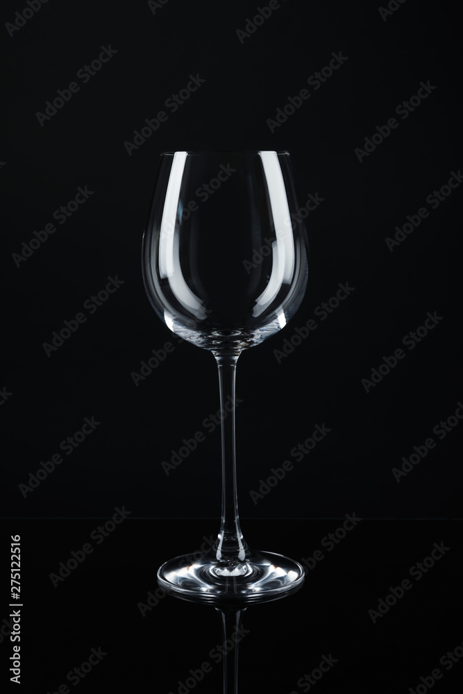 New empty wine glass on black background