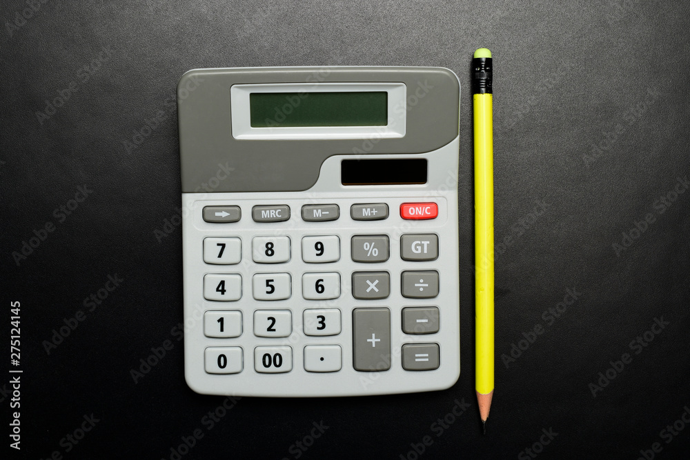 top view of calculator with yellow pencil, tax concept. top view of calculator with yellow pencil, tax concept.
