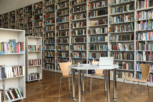 View of bookshelves and table in library