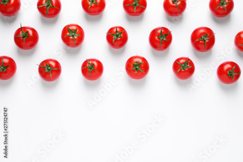Composition with ripe cherry tomatoes on white background, top view