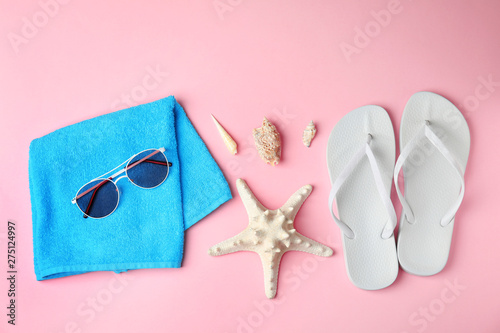 Flat lay composition with different beach objects on color background