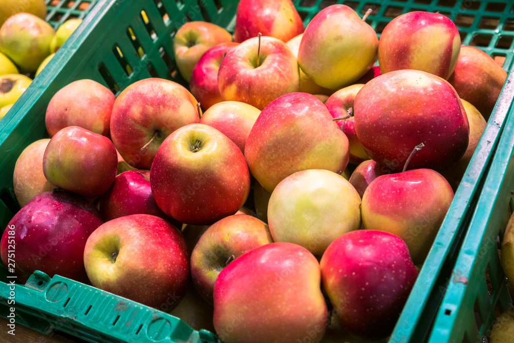 delicious juicy apples on the supermarket counter