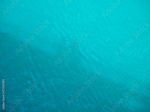 Wallpaper Mural shadows of people on a turquoise water surface Torontodigital.ca