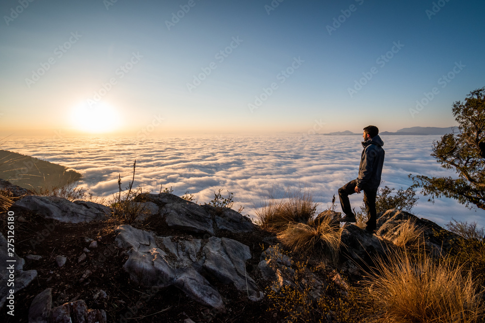 Man looking sunrise in mountain Man looking sunrise in mountain