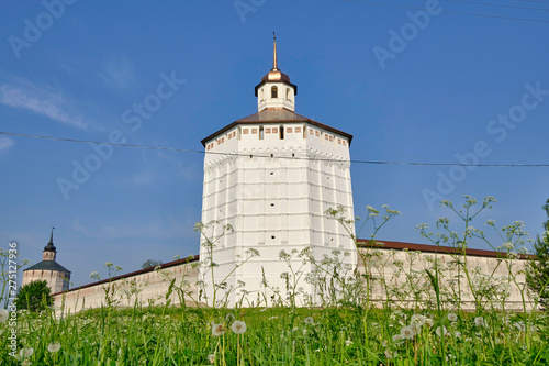 Scenic view of ancient brick wall with towers of old Cyril-Belozersky Monastery in Kirillov. Beautiful sunny summer look of orthodox male monastery in Vologodskaya oblast in Russian Federation