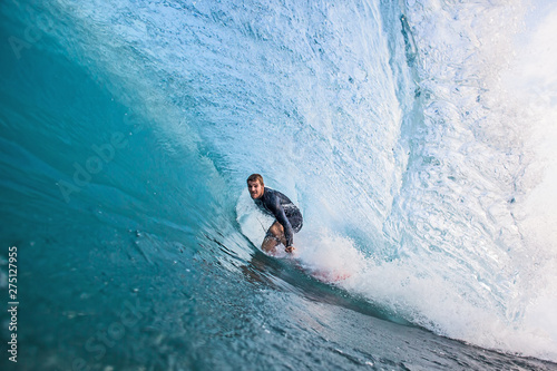 Surfer stands in a Tube photo