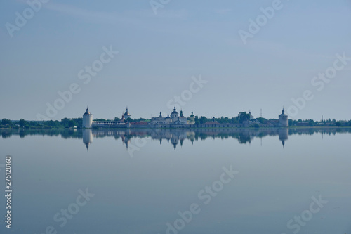 Scenic view of old Cyril-Belozersky Monastery in Kirillov. Beautiful sunny summer look of ancient male orthodox monastery with reflection in lake in Vologodskaya oblast in Russian Federation