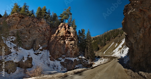 Russia. mountain Altai. Roads Aktash-Ulagan in the area of the gorge "Red gate". Unusual yellow-red color of local rocks due to the high content of mercury in rocks.