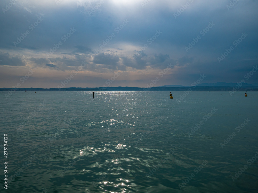Lake Gardasee Water view during Summer vacation time with a mediterranean feeling Lake Gardasee Water view during Summer vacation time with a mediterranean feeling