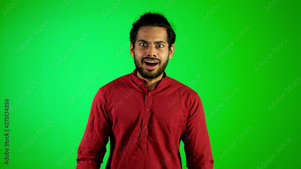 Indian guy surprising motion with green screen / green background Indian guy surprising motion with green screen / green background