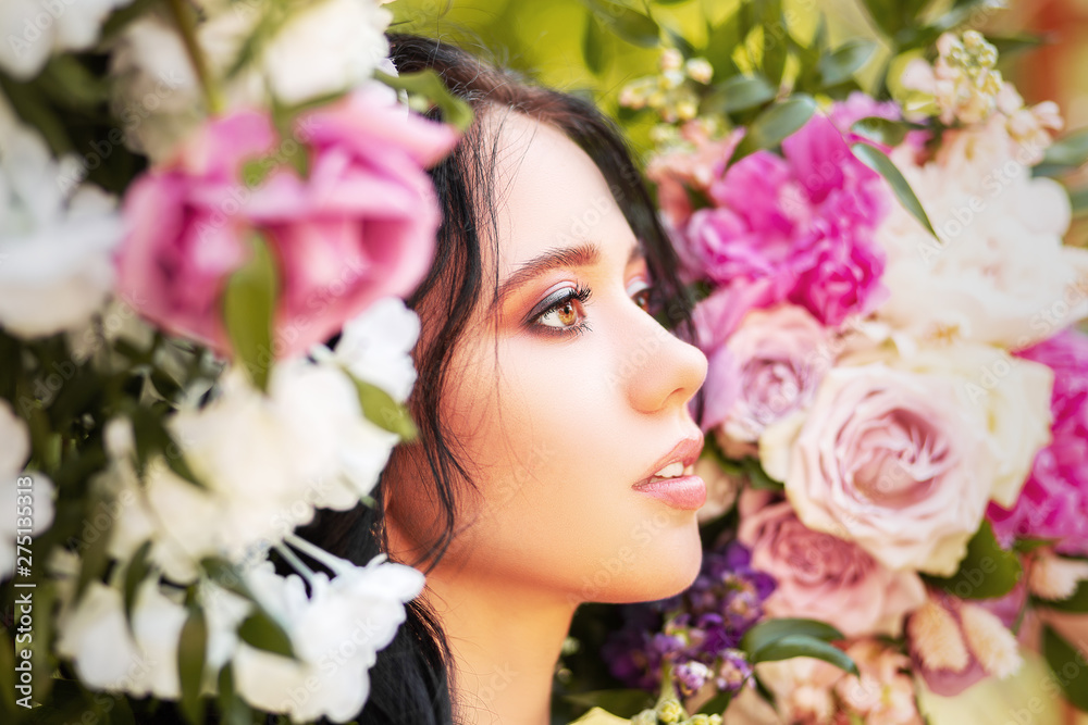 Close up, romantic portrait of young beautiful woman with flowers around her face. Inspiration of spring and summer. Perfume, cosmetics concept. Close up, romantic portrait of young beautiful woman with flowers around her face. Inspiration of spring and summer. Perfume, cosmetics concept.