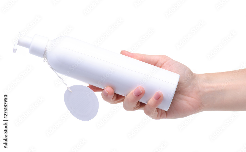 White bottle with dispenser beauty product in hand on white background isolation White bottle with dispenser beauty product in hand on white background isolation