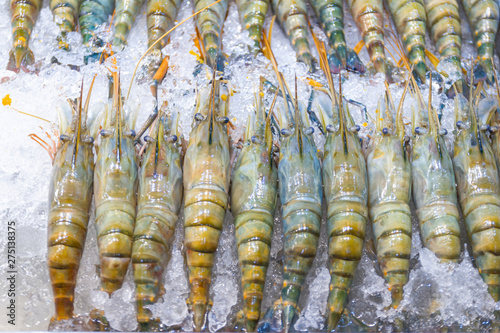 group big fresh shrimp on the ice in supermarket Thai market