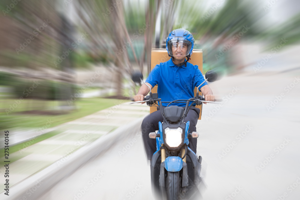 Delivery boy on scooter with parcel box driving fast in rush. Courier delivering express by motorcycle