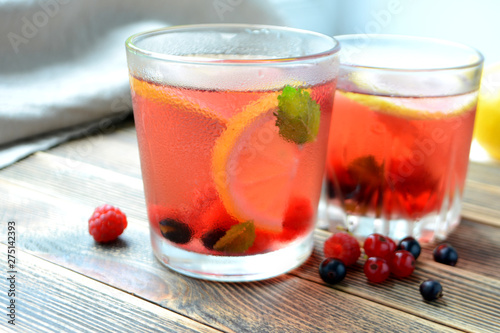 Cold berry lemonade in glasses Summer refreshing drink