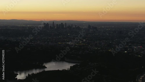 Aerial sunrise view LA cityscape from Hollywood Reservoir