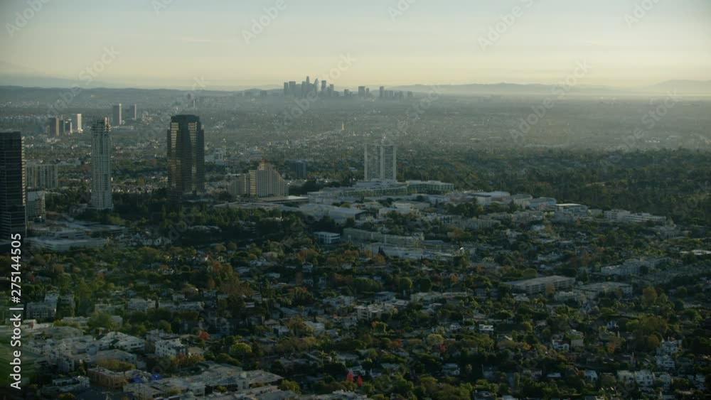 Aerial view at sunrise LA suburbs and skyline Aerial view at sunrise LA suburbs and skyline