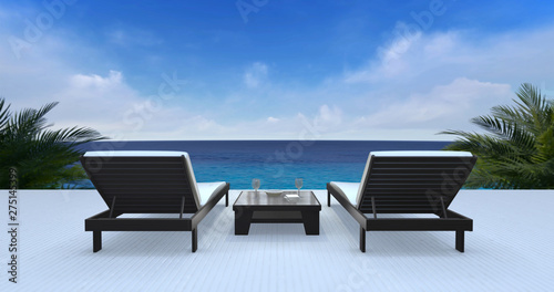 Two wooden loungers on terrace with ocean view and blue sky
