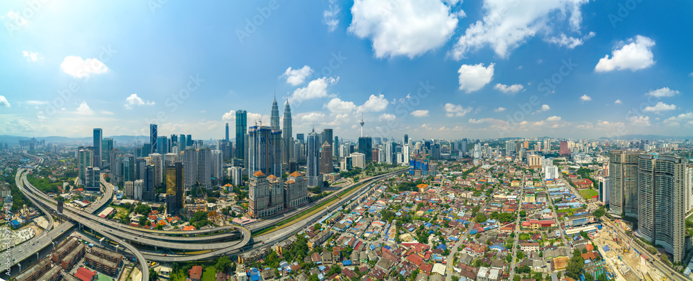 Fototapeta premium Modern Skyscraper and Traditional Housing Area at Kuala Lumpur, Malaysia