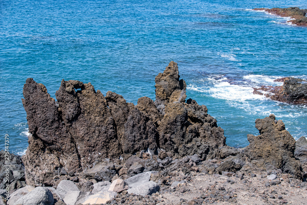 Rocky volcanic coastline at Mirador Playa Los Guirres, La Palma, Canary Islands, Spain