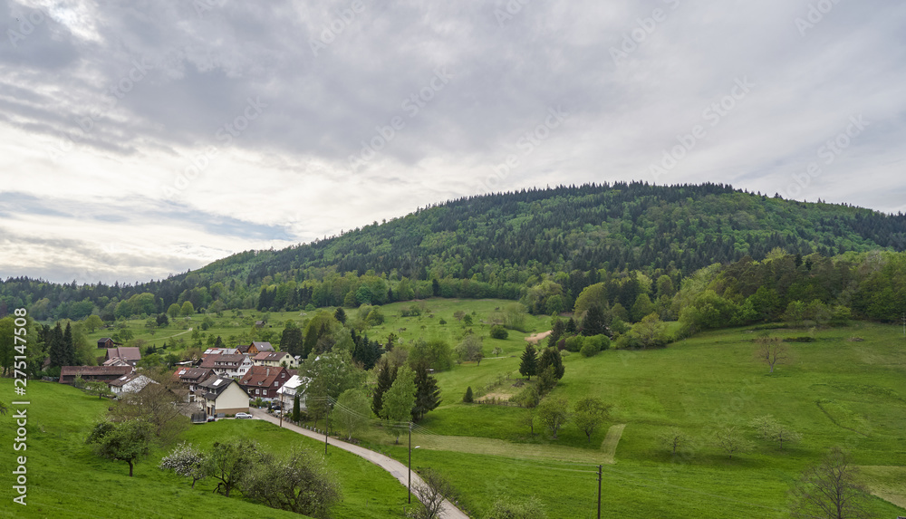 Beautiful evening landscape, a small European village in Germany and the mountains of the Schwarzwald